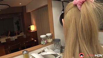 A Japanese housewife with small tits and blonde hair pleasures her husband in the kitchen without any censorship.